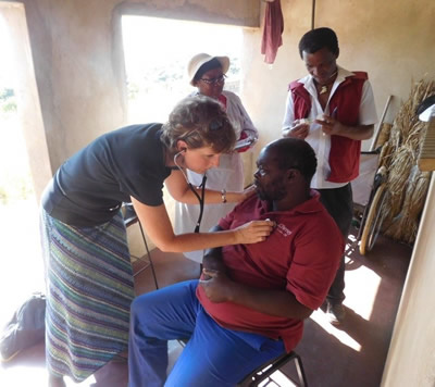 Prof. Anita Nicholson examining a patient in Swaziland