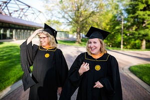 Two students in graduation ceremony