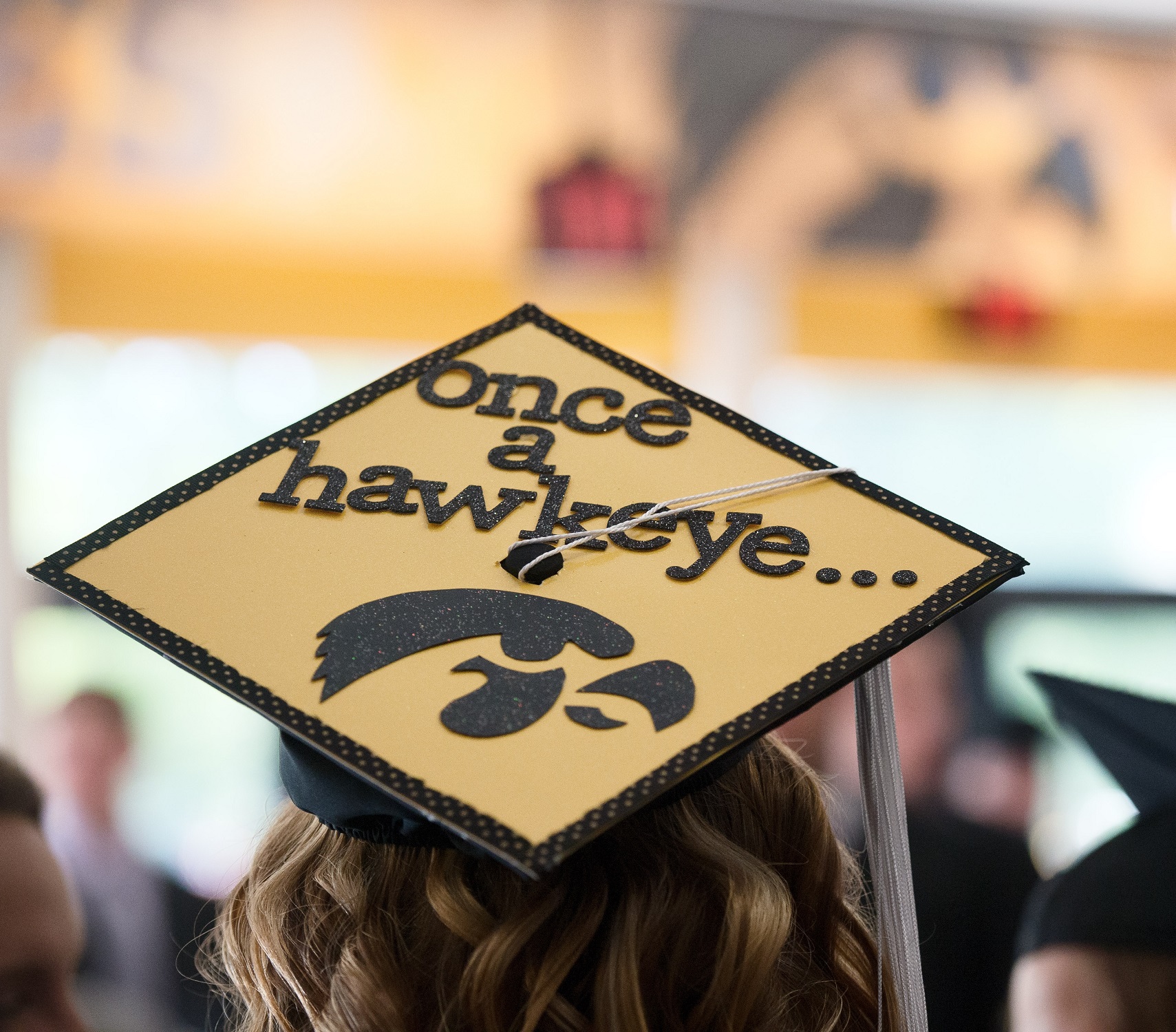 A graduation cap that says "once a Hawkeye..."