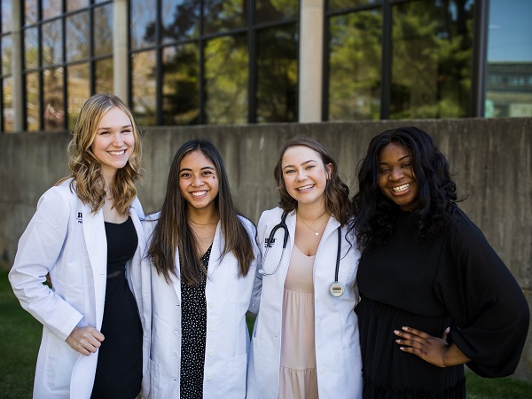 Students outside the College of Nursing building