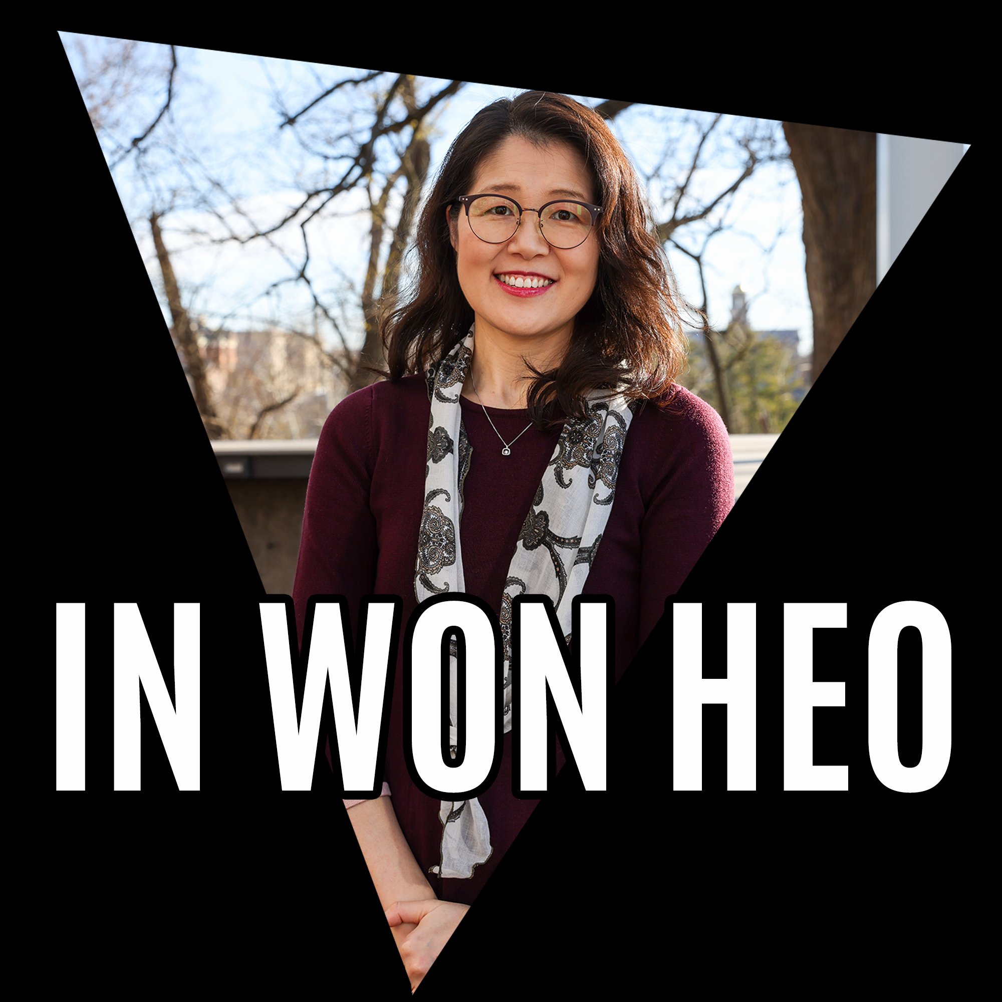 Portrait of smiling woman with the name In Won Heo in large white letters. 