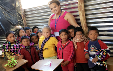 Yurico Martinez with children in Guatemala
