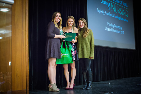 three Recent BSN Grad students holding the DAISY award