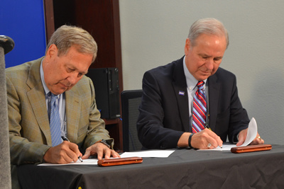 President Harreld signing the UI3 agreement
