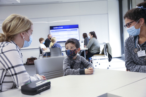 Nurse practitioner students talk with and check the vitals of a child at a pediatric simulation held for students in the NP program in the College of Nursing Building on Wednesday, Nov. 17, 2021. Students had a chance to apply their clinical skills in a low-stakes setting by practicing well checks on children of various ages.