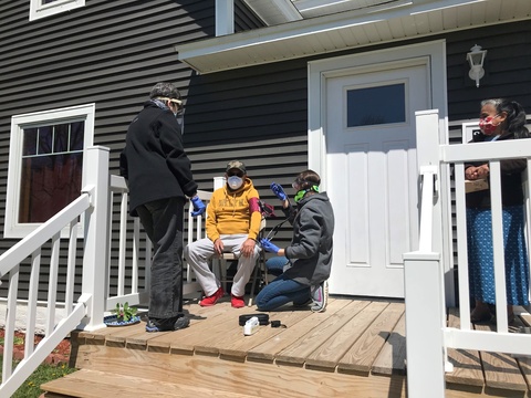 Emily Sinnwell visits a patient at home in Postville, Iowa during the height of the COVID-19 pandemic.