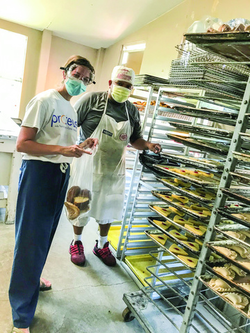 Emily Sinnwell is photographed in the Bell's Melons farm kitchen, where sweet bread is baked for workers.