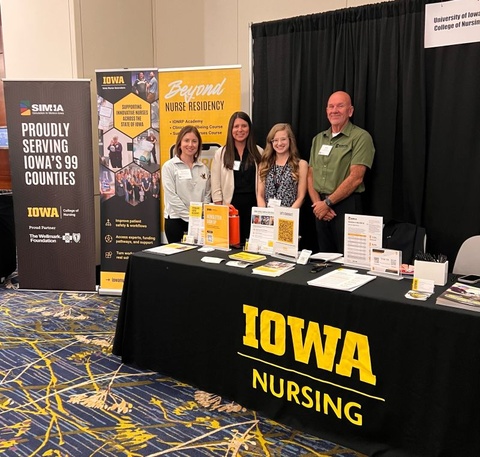 Representatives from the Iowa Online Nurse Residency Program, University of Iowa College of Nursing Admissions & Enrollment, Simulation in Motion-Iowa (SIM-IA), and the University of Iowa Office of Innovation's Iowa Nurse Innovators initiative exhibited together at the 97th Iowa Hospital Association Annual Meeting in Des Moines, highlighting collaborative efforts to strengthen Iowa's healthcare workforce.