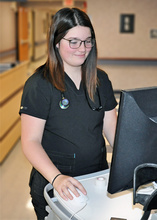 A nurse at her computer