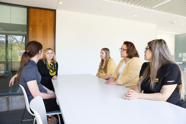 Members of Julie Vignato’s research team meet in the College of Nursing Building