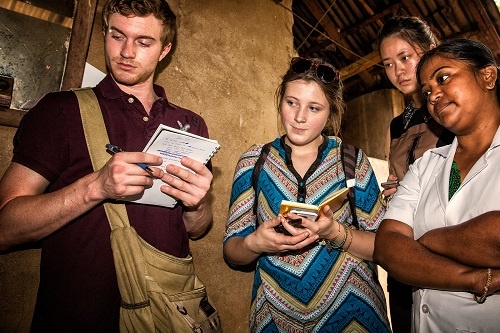 Students visiting patient home in India
