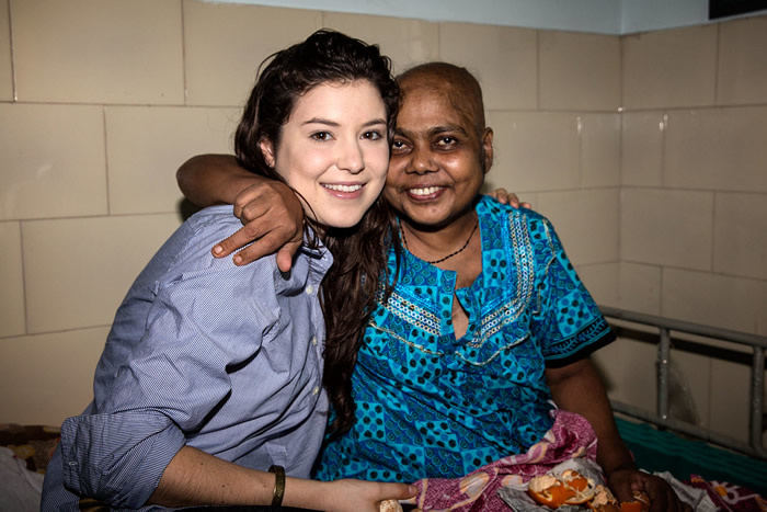 A nursing student with a patient in India