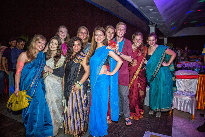 Iowa Nursing students in sarees (traditional Indian attire) posing for a picture