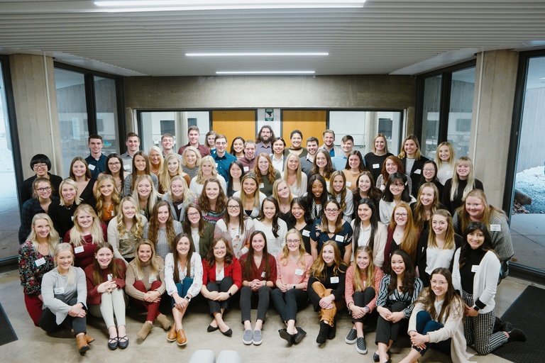 Large group of students post for a group picture during BSN orientation