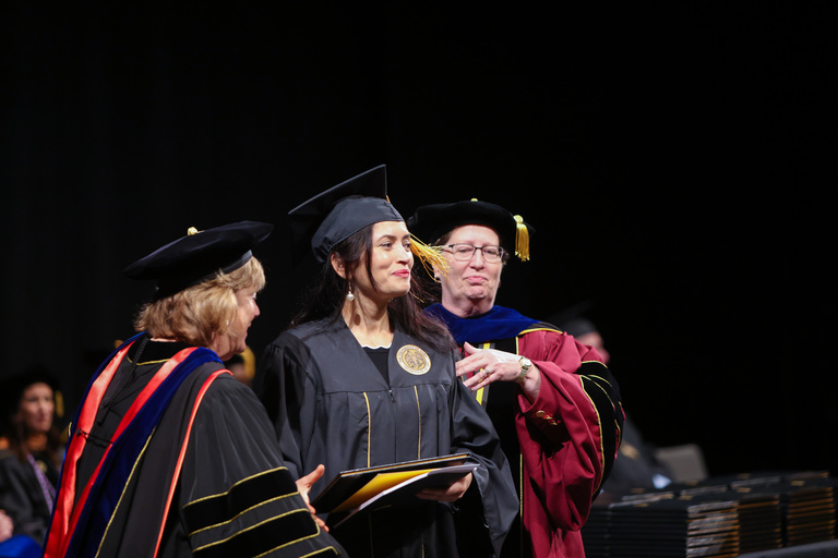 President Wilson and Dean Zerwic confer a degree. 