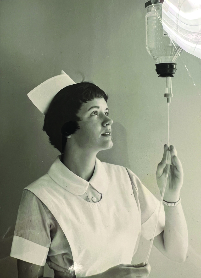 nurse with iv bag