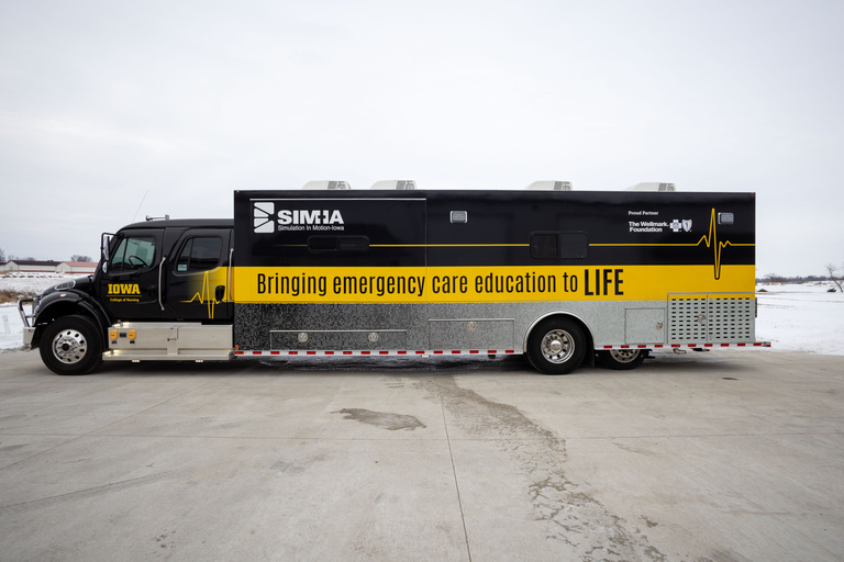 Semi-type truck wrapped in black and gold