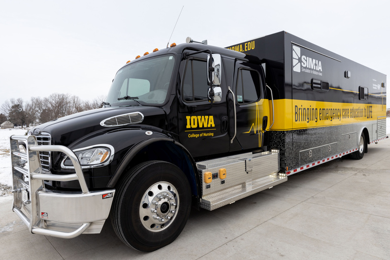 Semi-type truck wrapped in black and gold