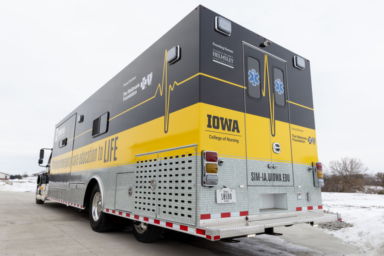 Semi-type truck wrapped in black and gold