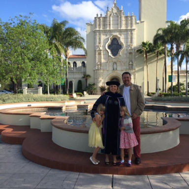 Viganto pictured with her family at her PhD graduation.