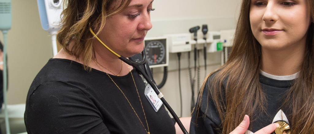 A nurse examining a patient