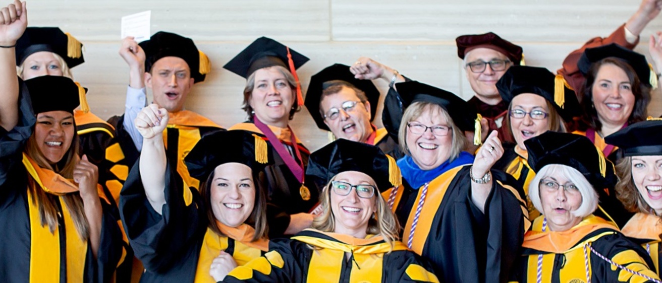 DNP Faculty and Students in graduation robes
