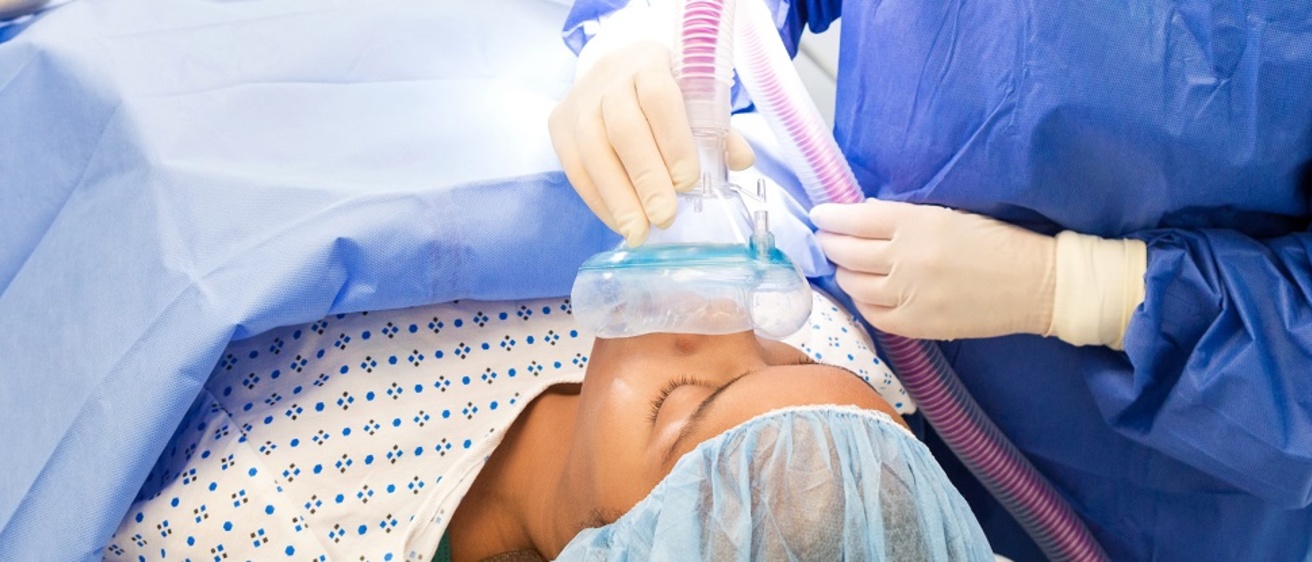 a nurse practitioner administering anesthesia to a patient