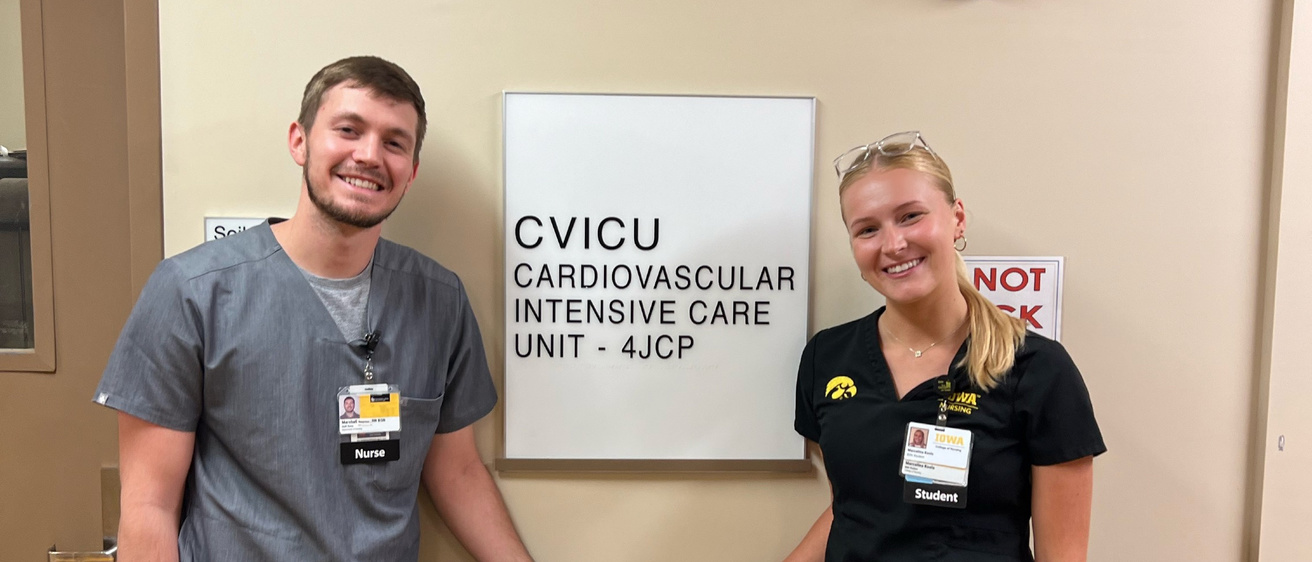 Nurse and student outside cardio vascular ICU