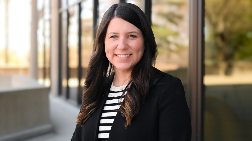 Nicole Weathers in front of the College of Nursing Building