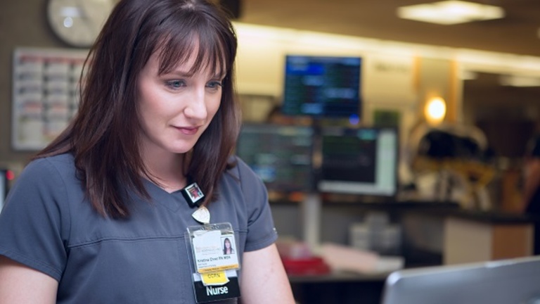 A nurse at her computer