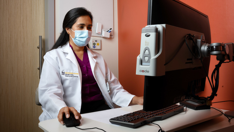 A nurse at her computer